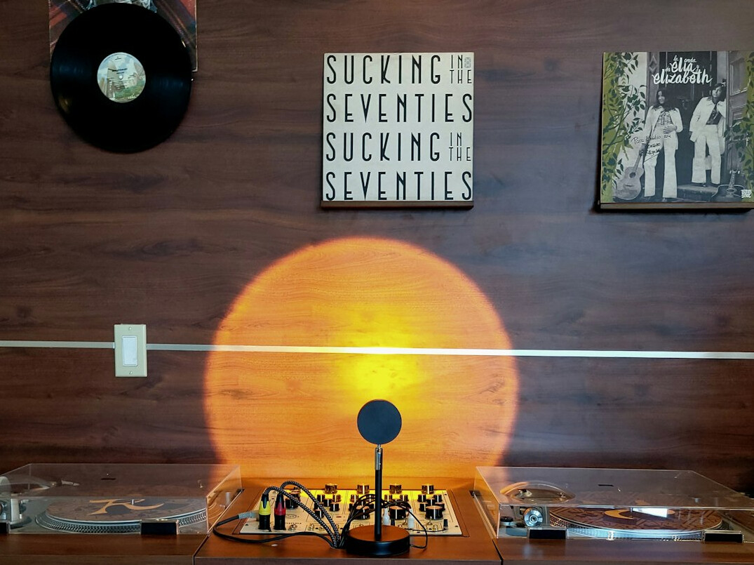 Interior of a modern podcast recording studio with acoustic panels and microphones