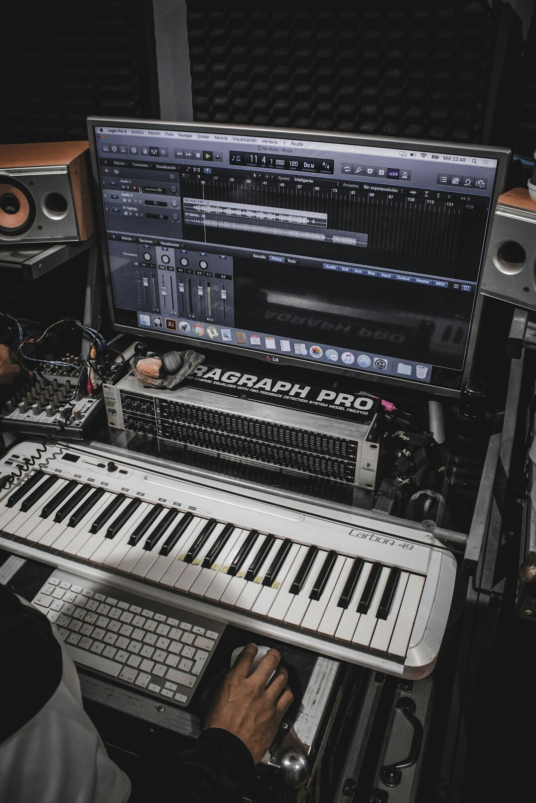 Audio editing workstation with mixing console and monitors
