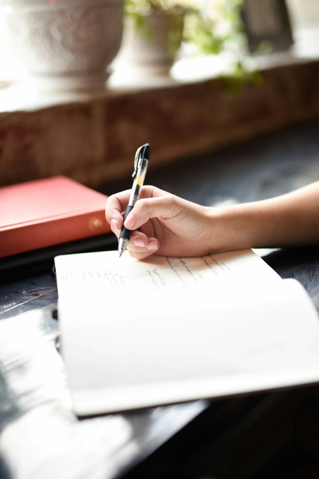 blogger writing in notebook